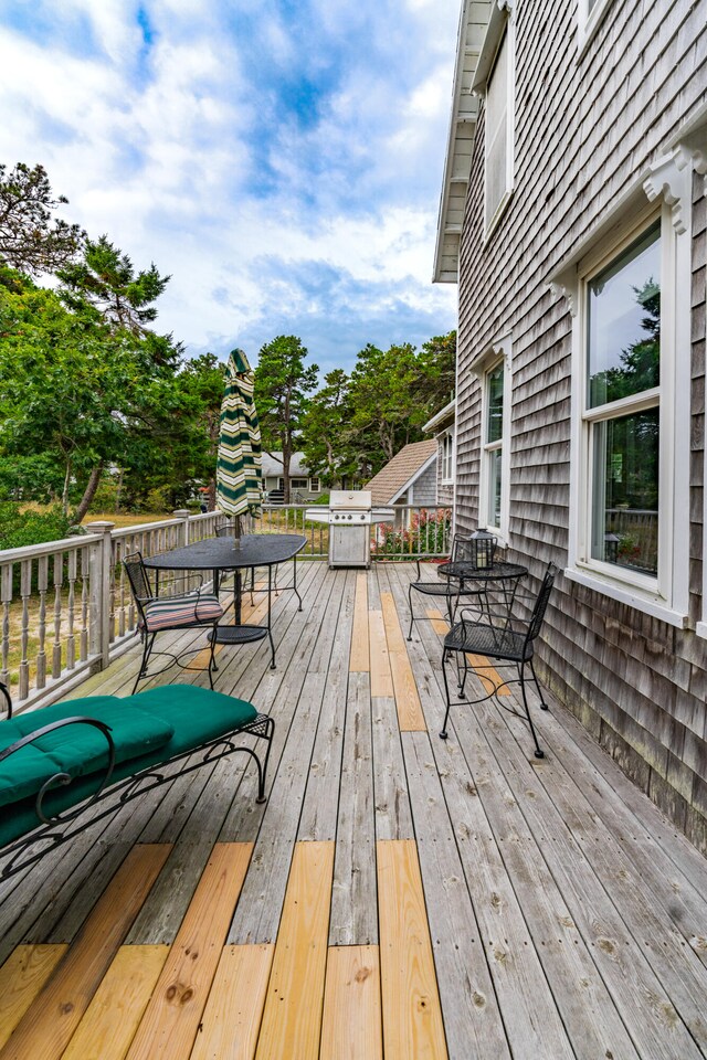 wooden deck featuring grilling area