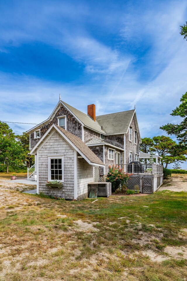 back of house with a yard