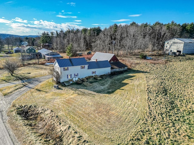 drone / aerial view featuring a view of trees