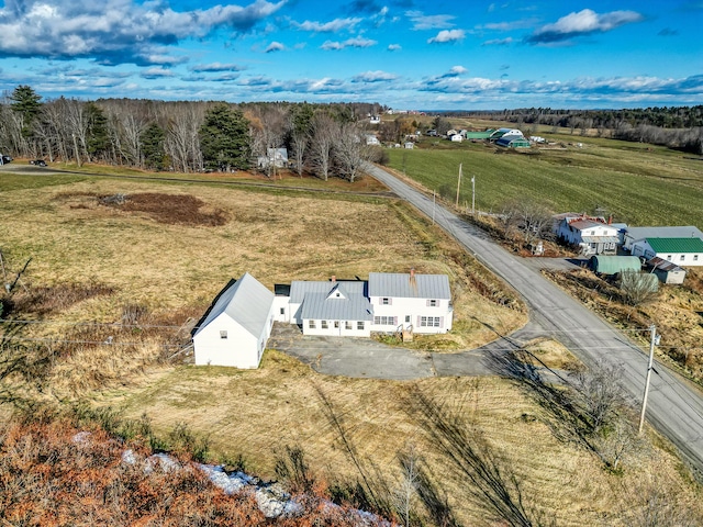 birds eye view of property with a rural view