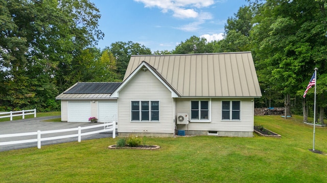 view of front of property featuring a garage and a front lawn