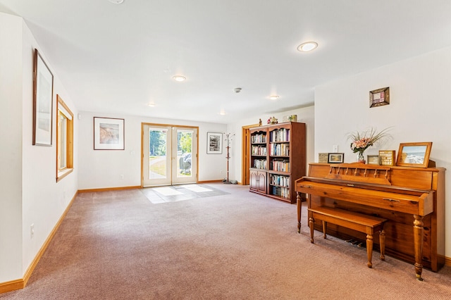 misc room featuring french doors and light colored carpet