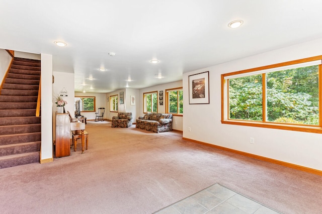 unfurnished living room with light colored carpet