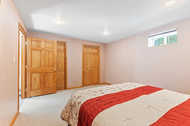 bedroom featuring light carpet