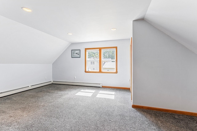 bonus room featuring lofted ceiling, a baseboard radiator, and carpet