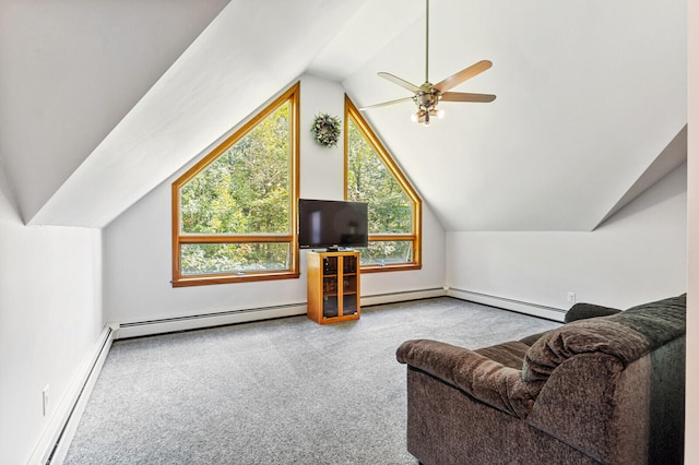 interior space featuring a baseboard heating unit, vaulted ceiling, plenty of natural light, and ceiling fan