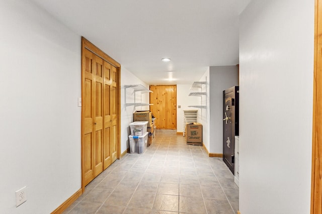 hallway featuring light tile patterned floors