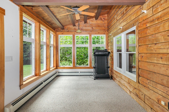 unfurnished sunroom with ceiling fan, vaulted ceiling with beams, wood ceiling, and a healthy amount of sunlight