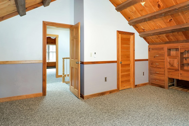 additional living space featuring carpet flooring, vaulted ceiling with beams, and wood ceiling