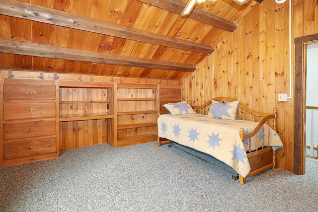 bedroom featuring wooden ceiling, carpet floors, and wood walls