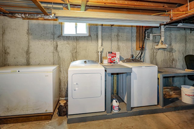 laundry room with washing machine and clothes dryer