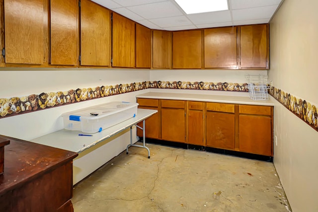 kitchen featuring a drop ceiling