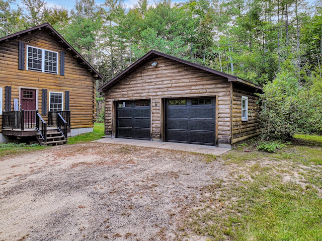 view of front of home with an outbuilding and a garage