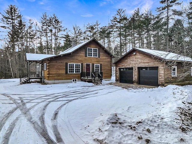 log cabin featuring a garage