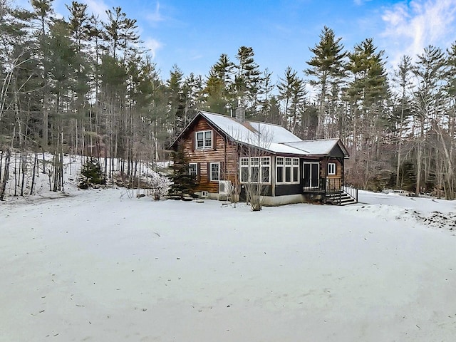 view of snow covered house