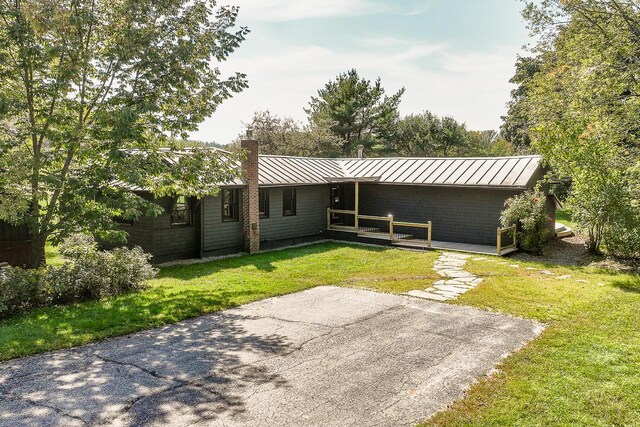 rear view of house with a yard