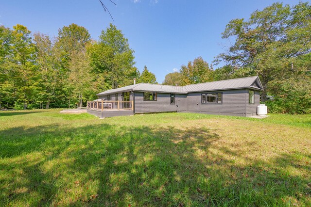 rear view of house with a yard