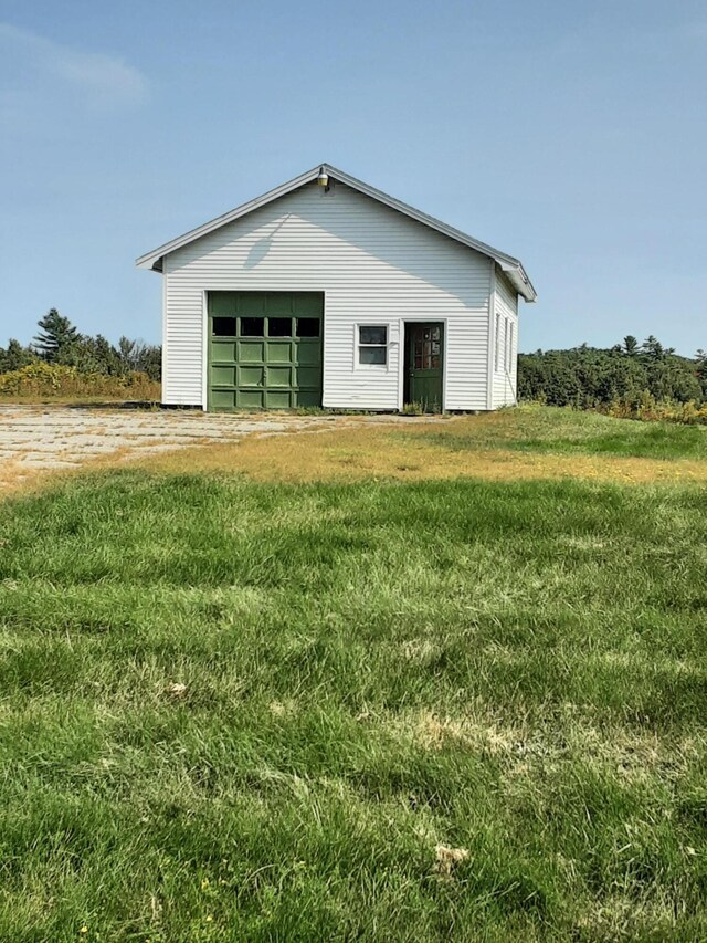 garage with a lawn