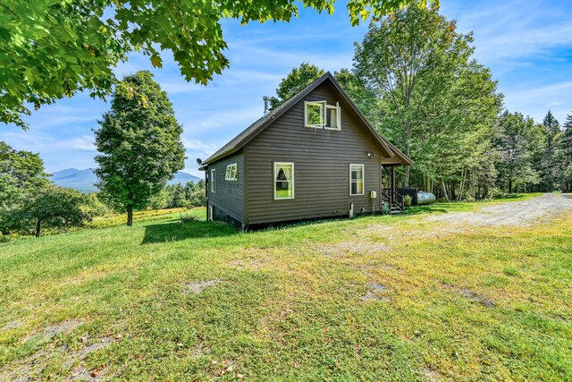 view of home's exterior with a lawn