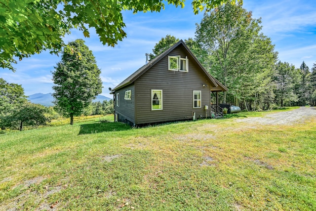 back of property with a lawn