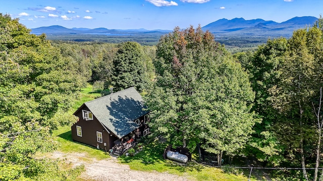 aerial view featuring a mountain view and a wooded view
