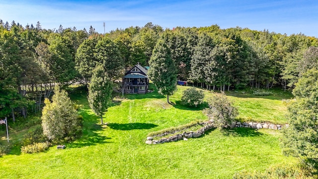 exterior space featuring a forest view