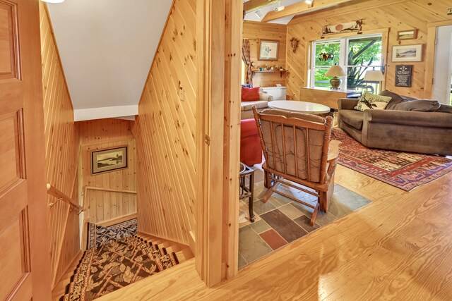 interior space featuring wooden walls and hardwood / wood-style flooring