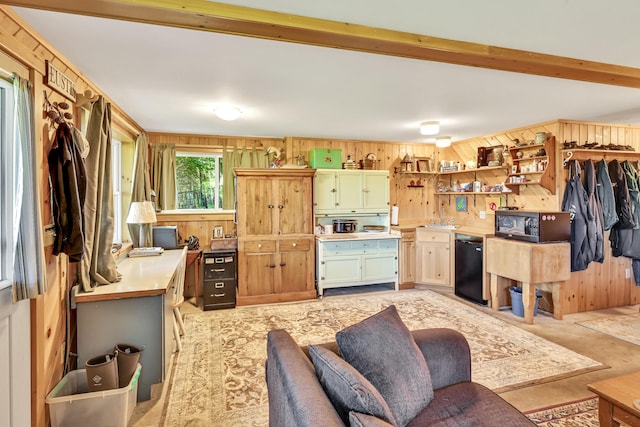 interior space with beamed ceiling and wood walls