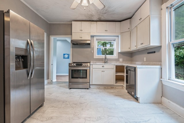 kitchen featuring ceiling fan, appliances with stainless steel finishes, and a wealth of natural light