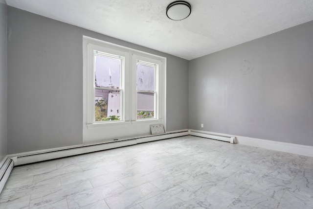 spare room with a textured ceiling