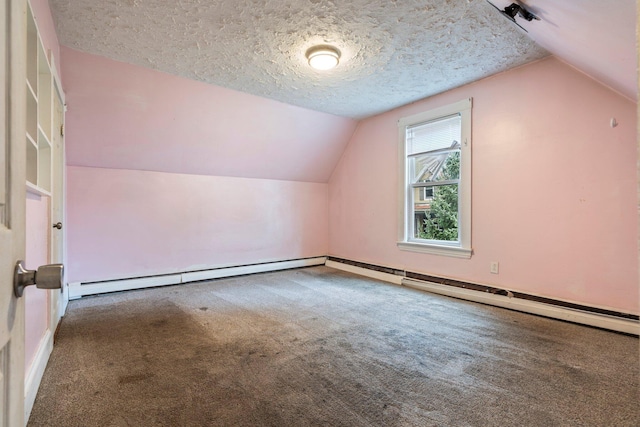 bonus room featuring carpet floors, a textured ceiling, vaulted ceiling, and a baseboard heating unit