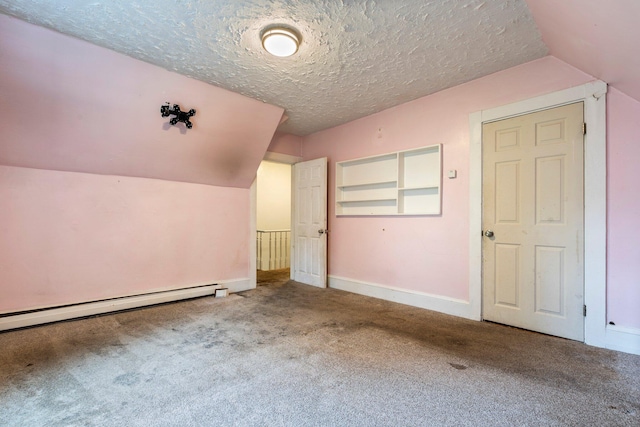 additional living space featuring lofted ceiling, a textured ceiling, and carpet flooring