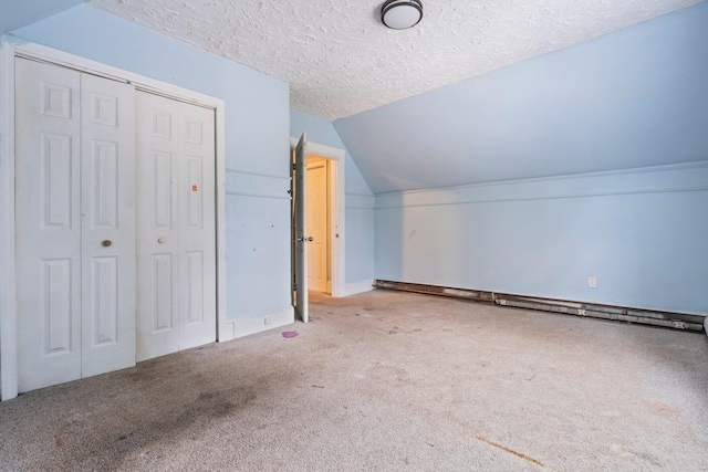 bonus room featuring lofted ceiling, a textured ceiling, and carpet floors