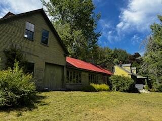 view of property exterior featuring a yard