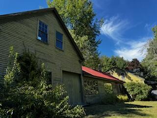 view of side of property with a garage
