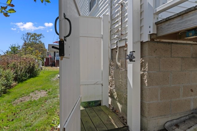 view of side of home featuring a lawn