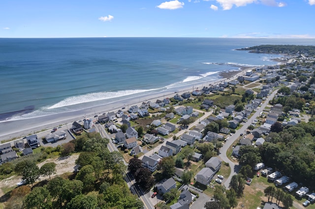 birds eye view of property featuring a view of the beach and a water view