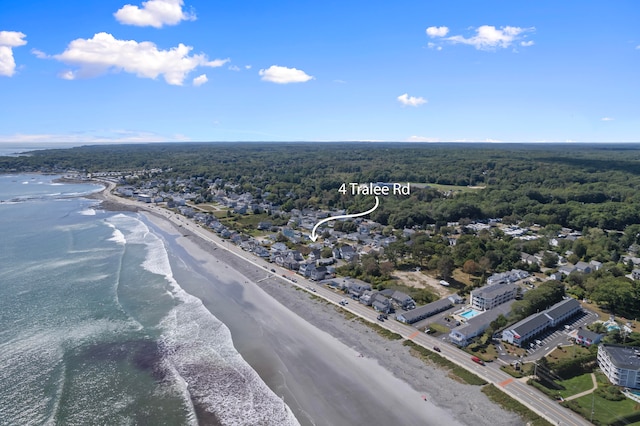 birds eye view of property featuring a water view and a view of the beach