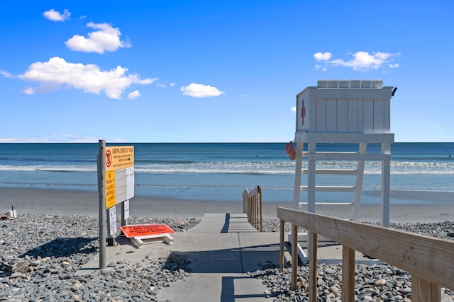 view of property's community featuring a view of the beach and a water view