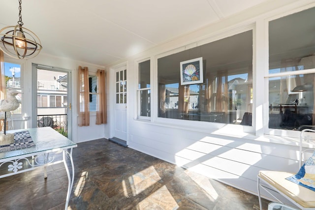 sunroom with a chandelier