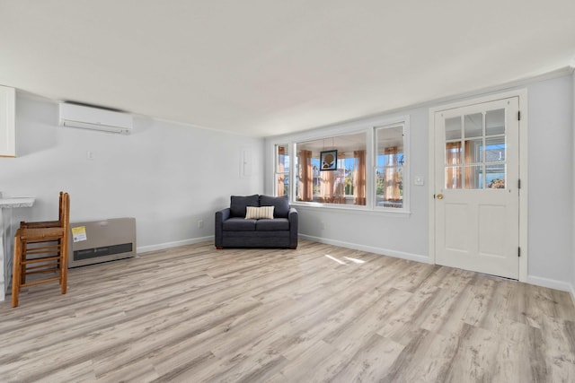 unfurnished room featuring light hardwood / wood-style floors and an AC wall unit