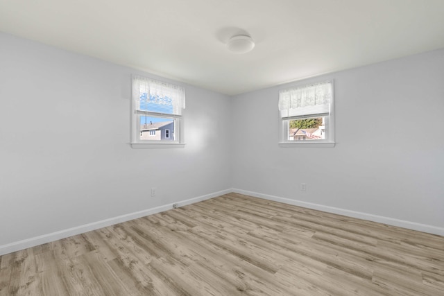 spare room featuring light hardwood / wood-style floors