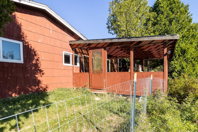 view of side of property with a yard