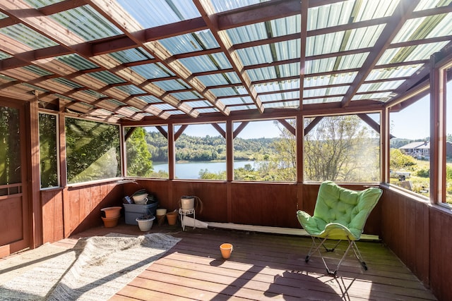 unfurnished sunroom with a water view