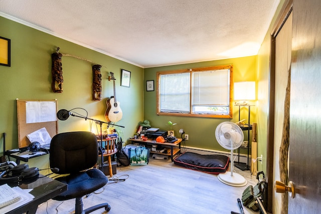 office space featuring wood-type flooring, ornamental molding, and a textured ceiling