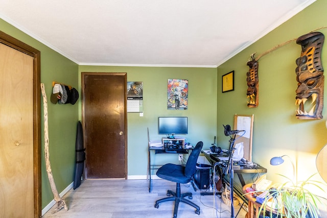 home office featuring crown molding and light hardwood / wood-style flooring