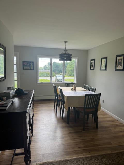 87 N Rd, Detroit, ME 04929 - dining space featuring dark wood-type flooring, a baseboard heating unit, and baseboards
