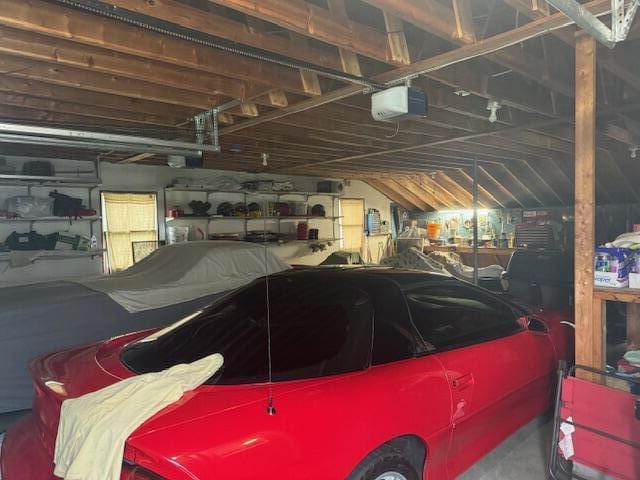87 N Rd, Detroit, ME 04929 - garage featuring a garage door opener