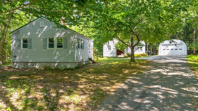 view of front of home featuring an outdoor structure and a garage