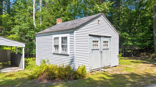 view of outdoor structure with a yard